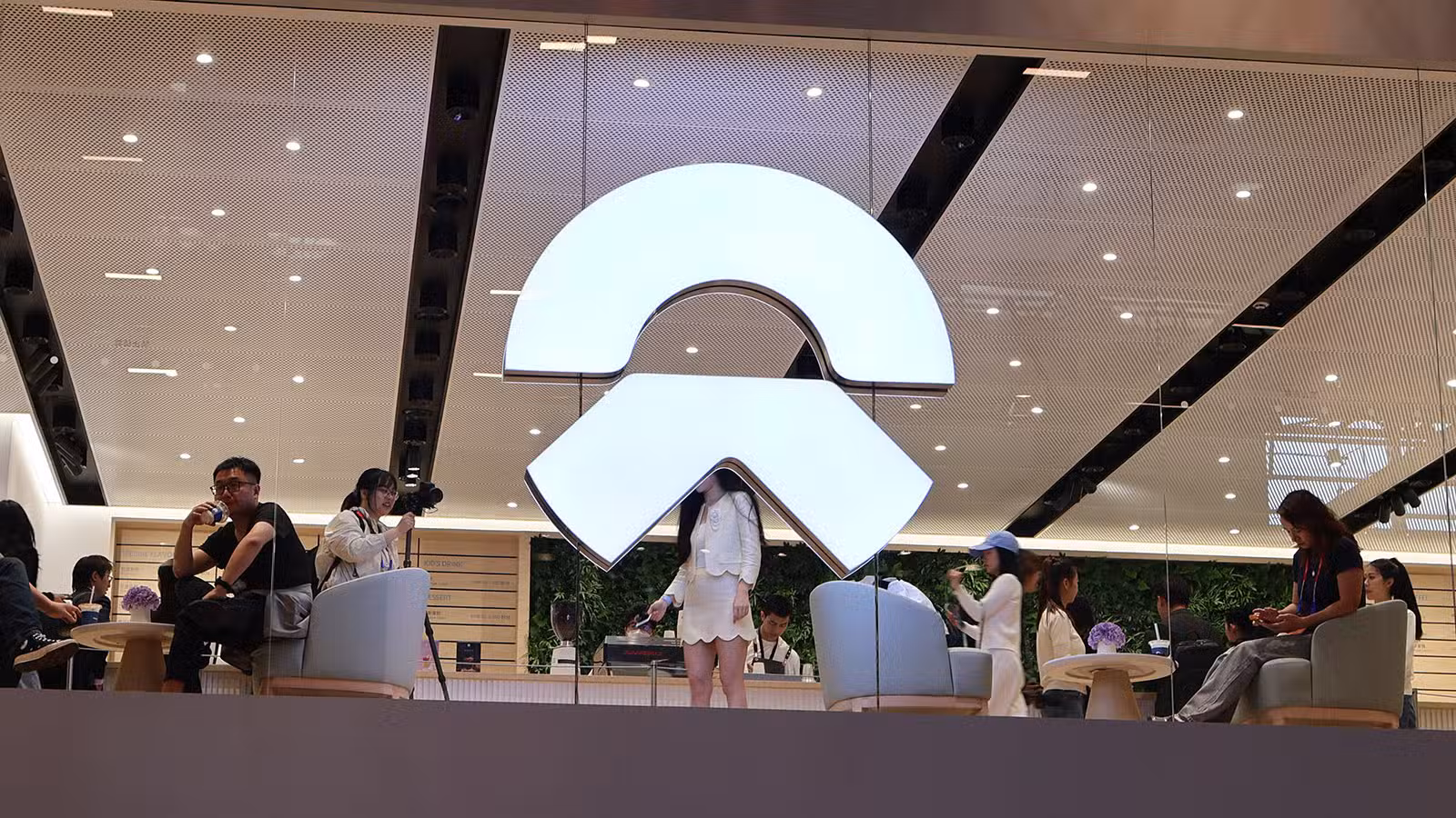 The Nio logo at the company's booth at the Beijing Auto Show in April 2026.