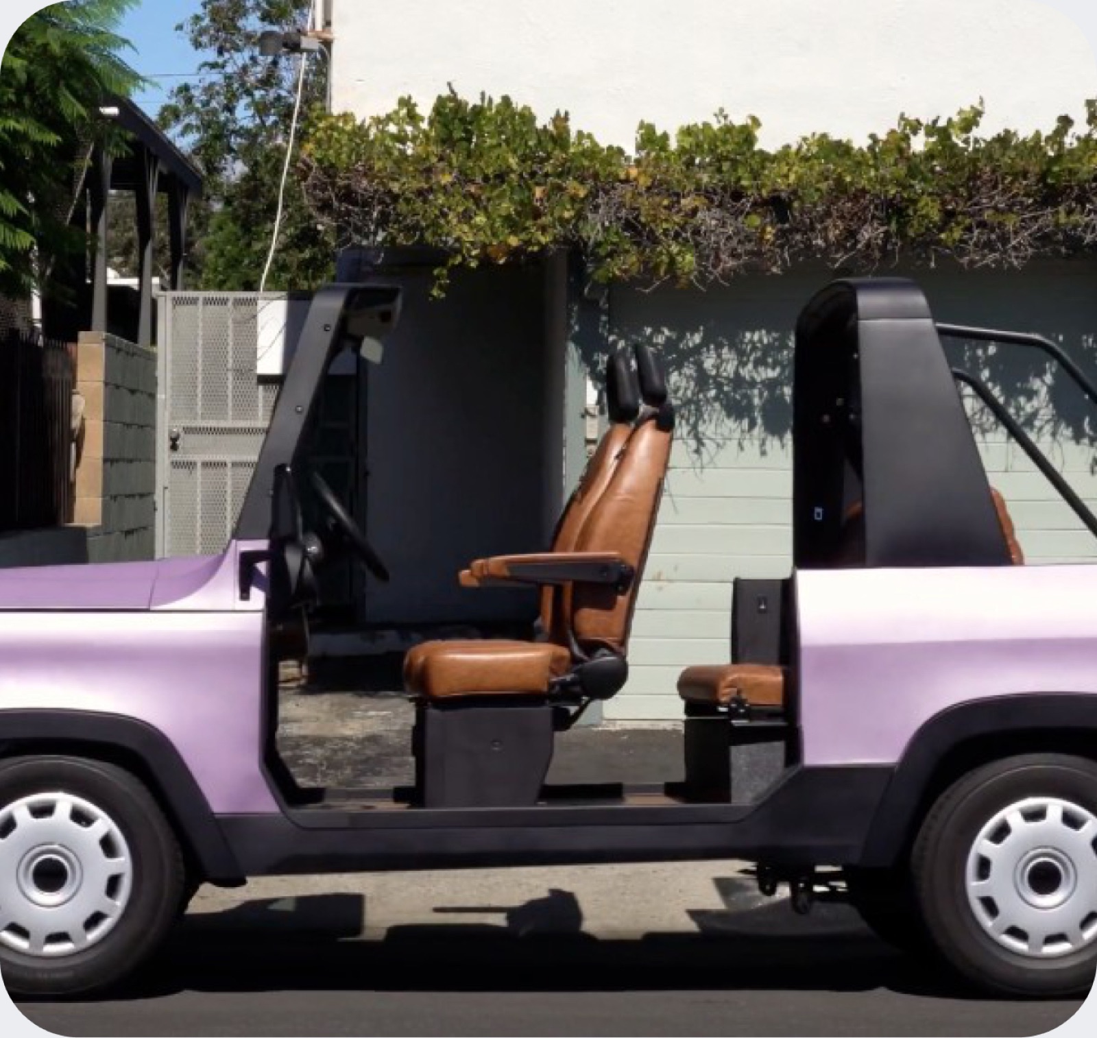 A purple Chip Motors LUV from the side with the doors off